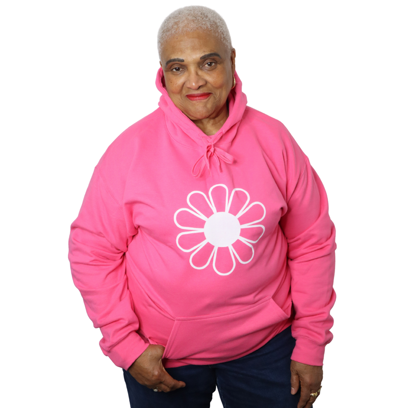 Woman wearing The Light Providers  pink flower hoodie on a white background