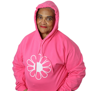 Woman wearing a pink hoodie with a white flower design on a white background