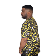 Model shown close up, wearing a sports jersey featuring an all over scattered light and firefly glow pattern in yellow and...