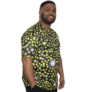 Model shown from a three quarter angle, wearing a sports jersey featuring an all over scattered light and firefly glow pat...