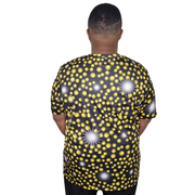 Model shown looking to the side, wearing a sports jersey featuring an all over scattered light and firefly glow pattern in...