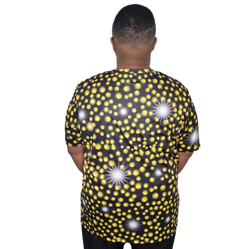 Model shown looking to the side, wearing a sports jersey featuring an all over scattered light and firefly glow pattern in...