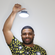 Model shown with arms crossed, wearing a sports jersey featuring an all over scattered light and firefly glow pattern in y...