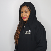Model shown from the front, wearing a black zip hoodie featuring The Light Providers logo patch on the chest and We Bring ...