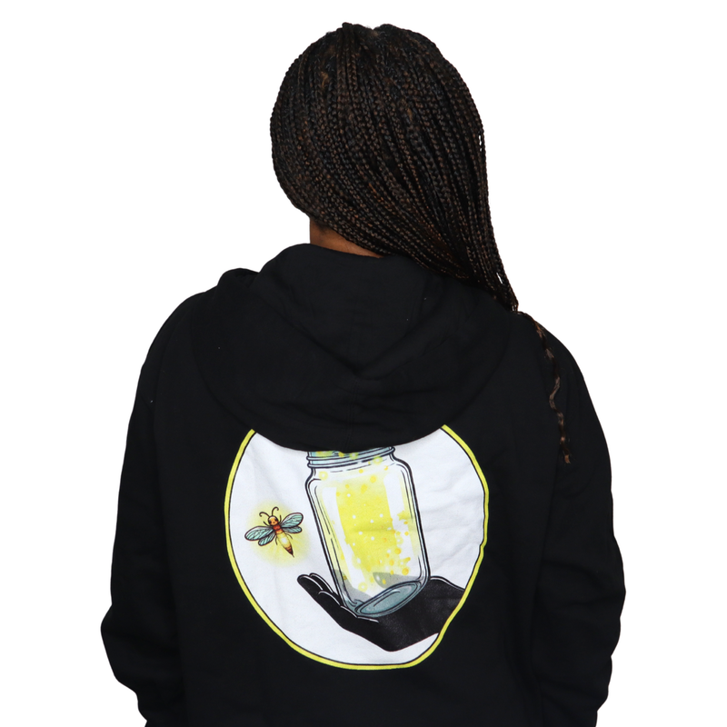 Model shown with hand on hip, wearing a black zip hoodie featuring The Light Providers logo patch on the chest and We Brin...