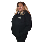 black zip hoodie shown flat, front view featuring The Light Providers logo patch on the chest and We Bring the Light text ...
