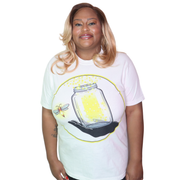 Model shown in side profile, wearing a garment dyed t-shirt featuring The Light Providers logo and firefly jar graphic in ...