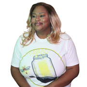 Model shown with arms crossed, wearing a garment dyed t-shirt featuring The Light Providers logo and firefly jar graphic i...