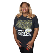 Model shown in a detail view of the print, wearing a garment dyed t-shirt featuring a scattered firefly light pattern abov...
