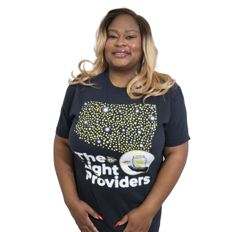 Model shown from a three quarter angle, wearing a garment dyed t-shirt featuring a scattered firefly light pattern above T...