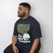 Model shown with arms crossed, wearing a garment dyed t-shirt featuring a scattered firefly light pattern above The Light ...