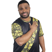Model shown from the front, wearing a t-shirt featuring a yellow monarch butterfly Ankara style print sash across a black tee