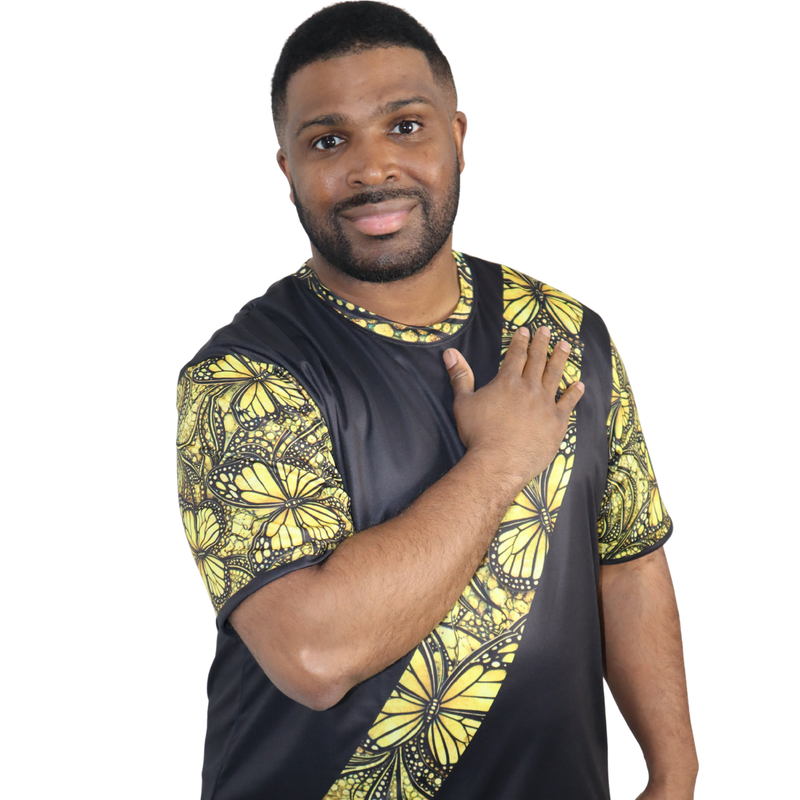 Model shown from the front, wearing a t-shirt featuring a yellow monarch butterfly Ankara style print sash across a black tee