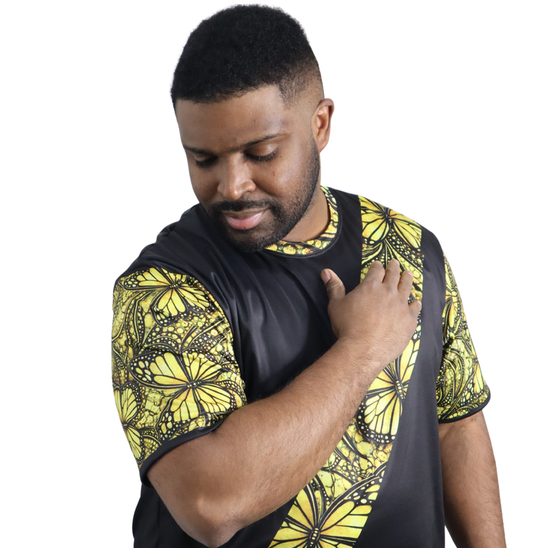 t-shirt shown flat, front view featuring a yellow monarch butterfly Ankara style print sash across a black tee