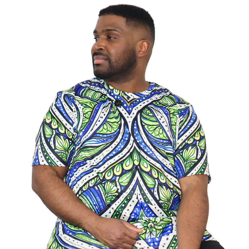 t-shirt shown flat, front view featuring an all over green white and blue Ankara style leaf pattern