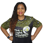 Person wearing a sports jersey featuring a scattered firefly light pattern with The Light Providers logo and firefly jar g...