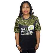 Model shown from a three quarter angle, wearing a sports jersey featuring a scattered firefly light pattern with The Light...