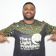 Model shown from the front, wearing a sports jersey featuring a scattered firefly light pattern with The Light Providers l...