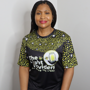 Model shown in side profile, wearing a sports jersey featuring a scattered firefly light pattern with The Light Providers ...