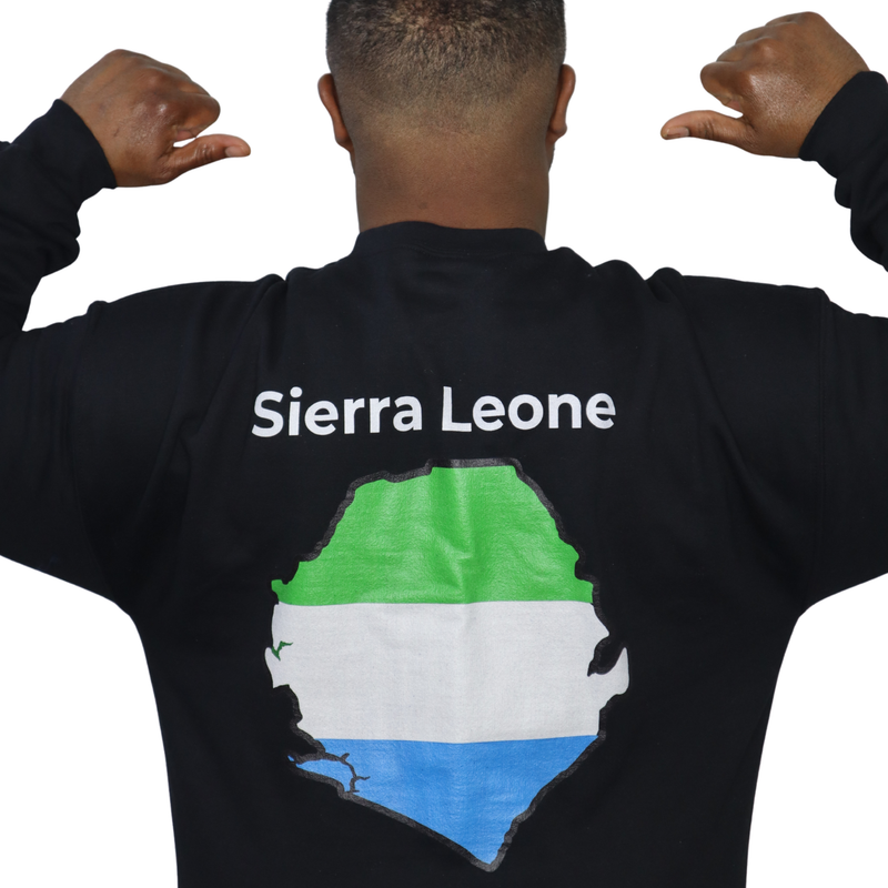 Person wearing a black crewneck sweatshirt featuring a Sierra Leone text and country outline map print in green white and ...