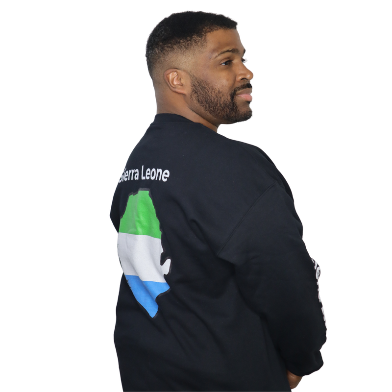 Model shown looking to the side, wearing a black crewneck sweatshirt featuring a Sierra Leone text and country outline map...