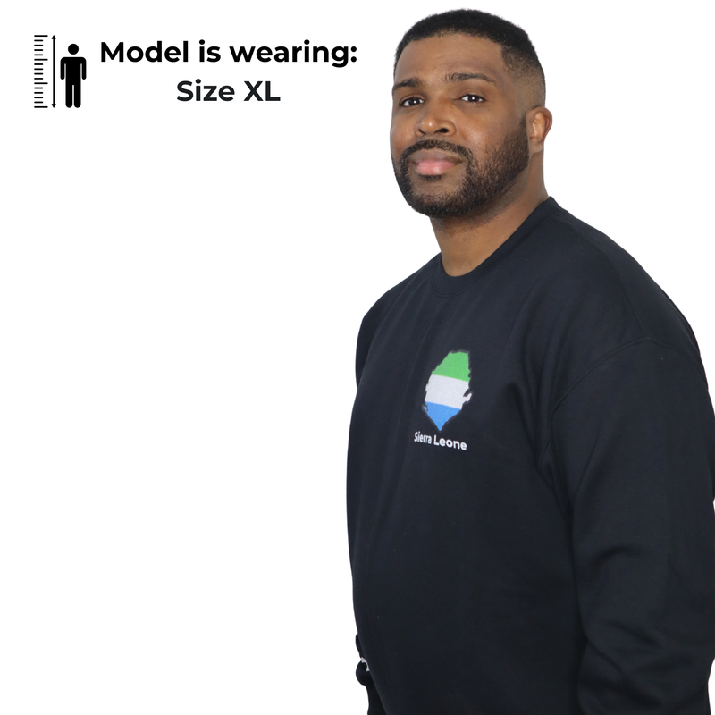 Model shown with arms crossed, wearing a black crewneck sweatshirt featuring a Sierra Leone text and country outline map p...