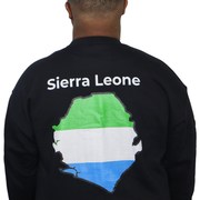 Model shown with hand on hip, wearing a black crewneck sweatshirt featuring a Sierra Leone text and country outline map pr...