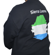 Model shown in side profile, wearing a black crewneck sweatshirt featuring a Sierra Leone text and country outline map pri...