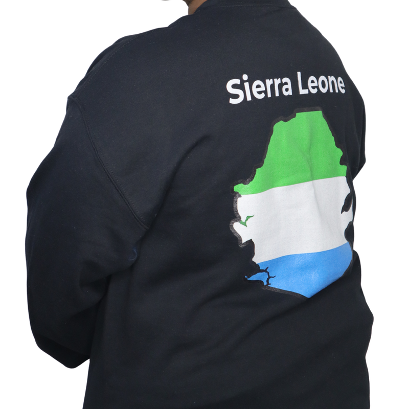 Model shown in side profile, wearing a black crewneck sweatshirt featuring a Sierra Leone text and country outline map pri...