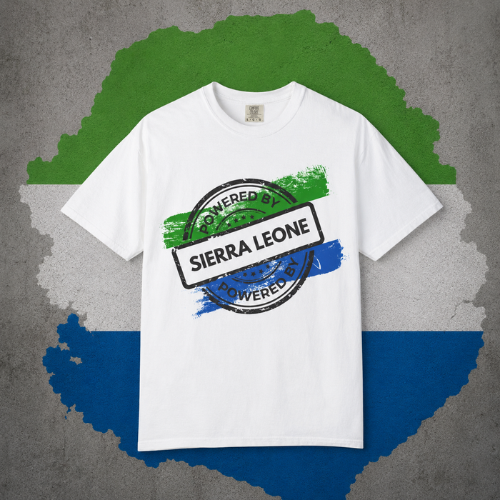 Powered By Sierra Leone stamp design in green white and blue on a black t-shirt, styled flat lay