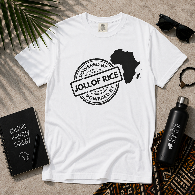 Powered By Jollof Rice stamp design with a white Africa map silhouette on a black t-shirt, styled product photo