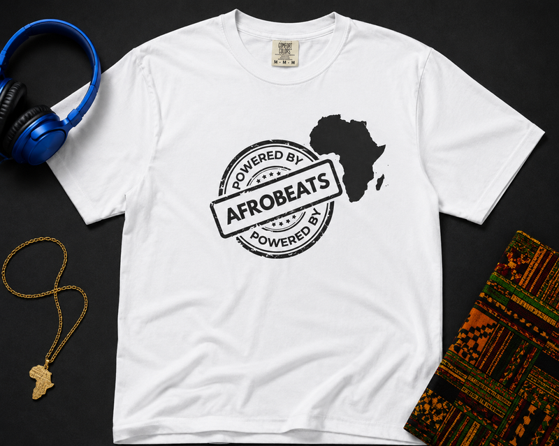 Powered By Afrobeats stamp design with a white Africa map silhouette on a black t-shirt, styled product photo