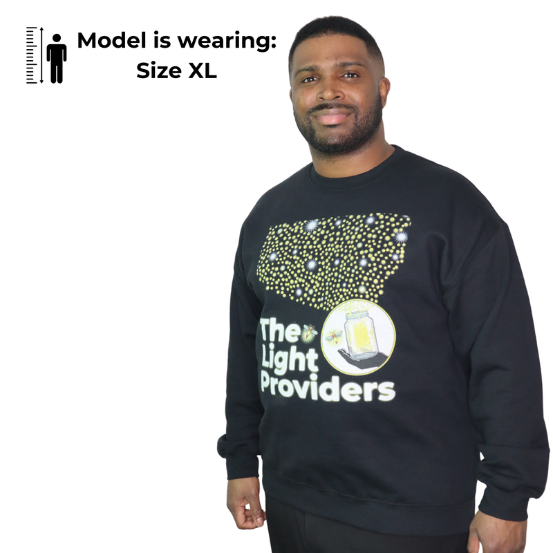 Man wearing a black sweatshirt with 'The Light Providers' logo on a white background