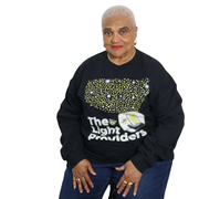 Woman wearing a black sweatshirt with The Light Providers Logo and text on a white background