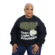Person wearing a black sweatshirt with 'The Light Providers' text and design on a white background