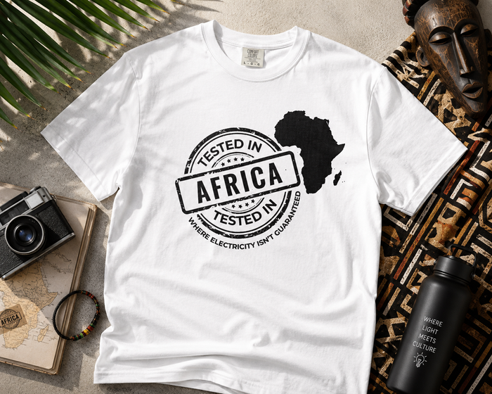 Tested In Africa stamp design with a white Africa map silhouette on a white t-shirt