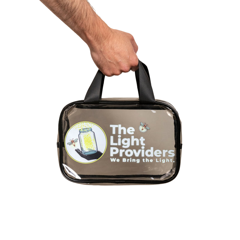 Clear Utility Travel Bag - being held by a hand