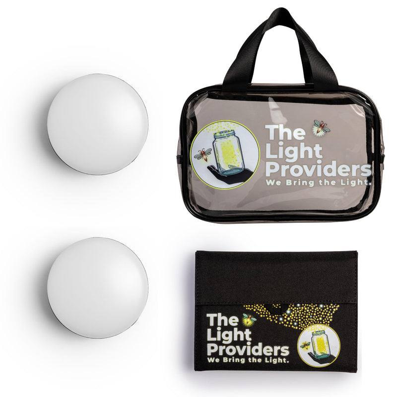 Two wireless lights, clear bag, and one solar panel on a white background