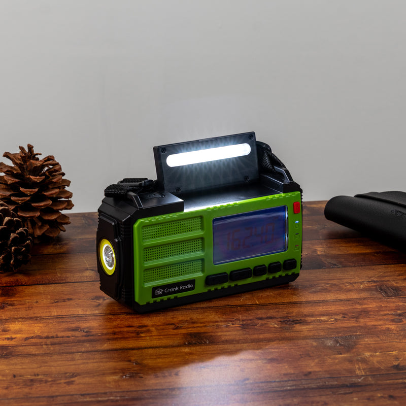 Survival Pro Emergency Radio - in use on a table with top light open