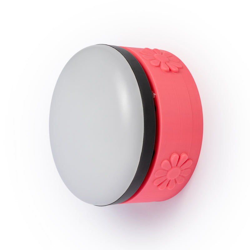 Pink flower wall mount with wireless light on a white background