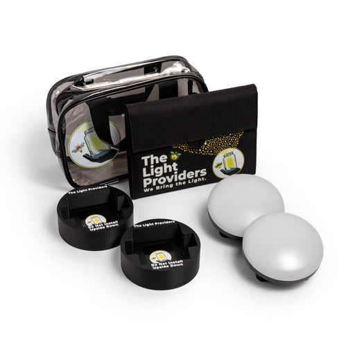 Clear utility bag, solar panel, two black mounts, two wireless lights