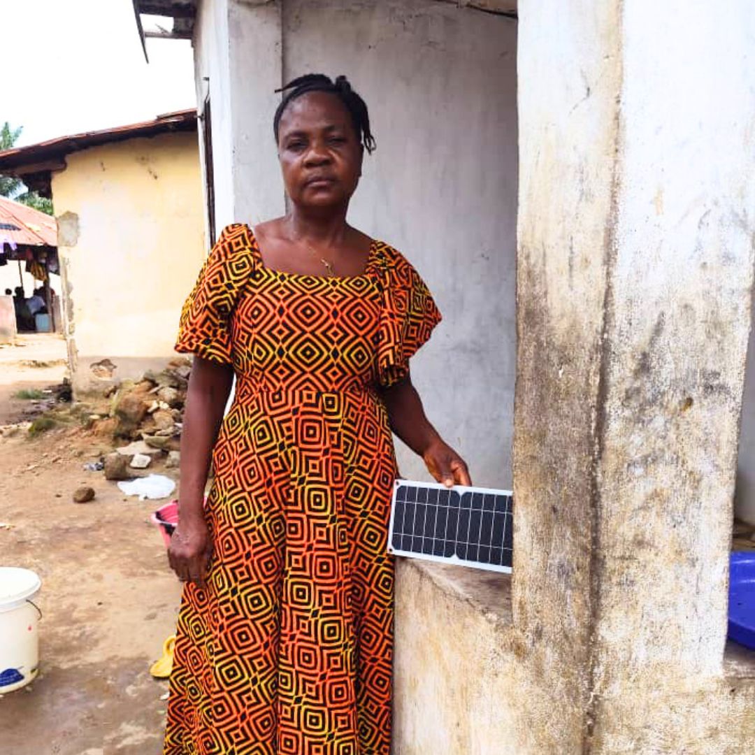 Woman Standing Withg Solar Panel
